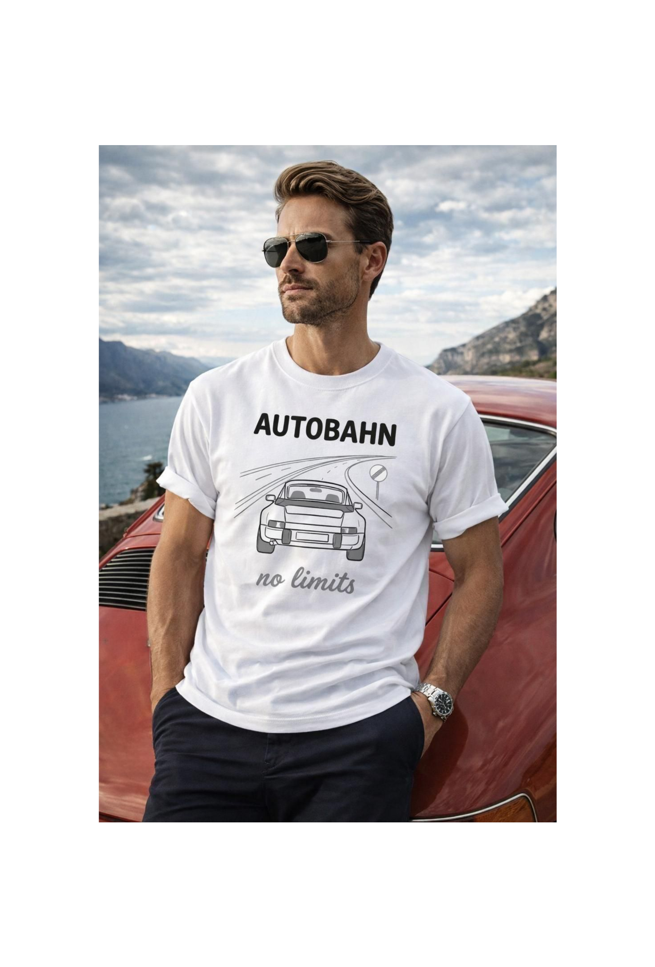 Man wearing a white t-shirt with 'AUTOBAHN no limits' design, standing next to a red car with a scenic background.
