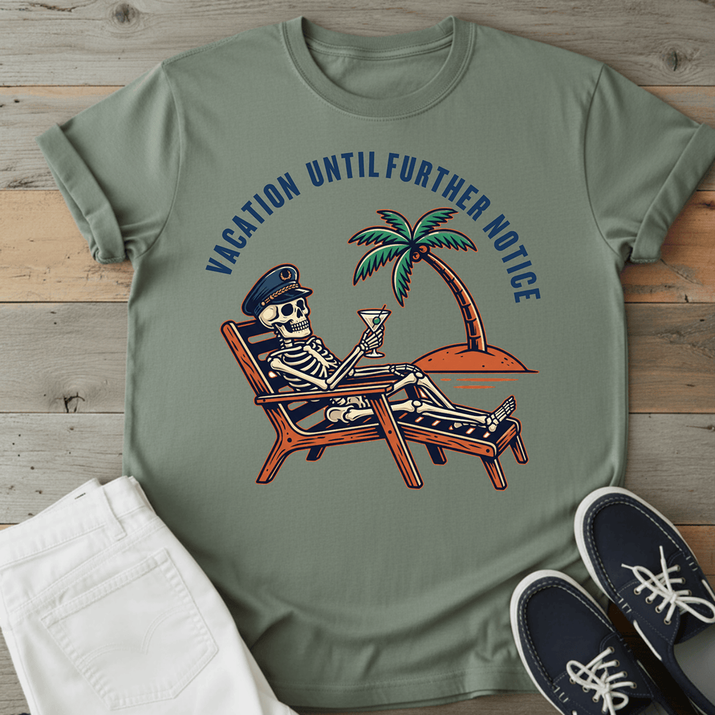 Optimistic Castaway T-Shirt featuring a skeleton relaxing with a drink under a palm tree, in a muted green color.