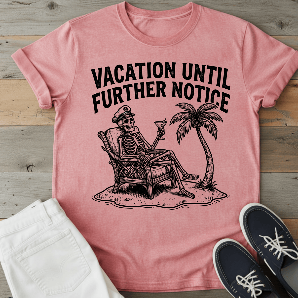 Retro Beach Skeleton T-Shirt in pink with a skeleton relaxing under a palm tree and text "VACATION UNTIL FURTHER NOTICE.