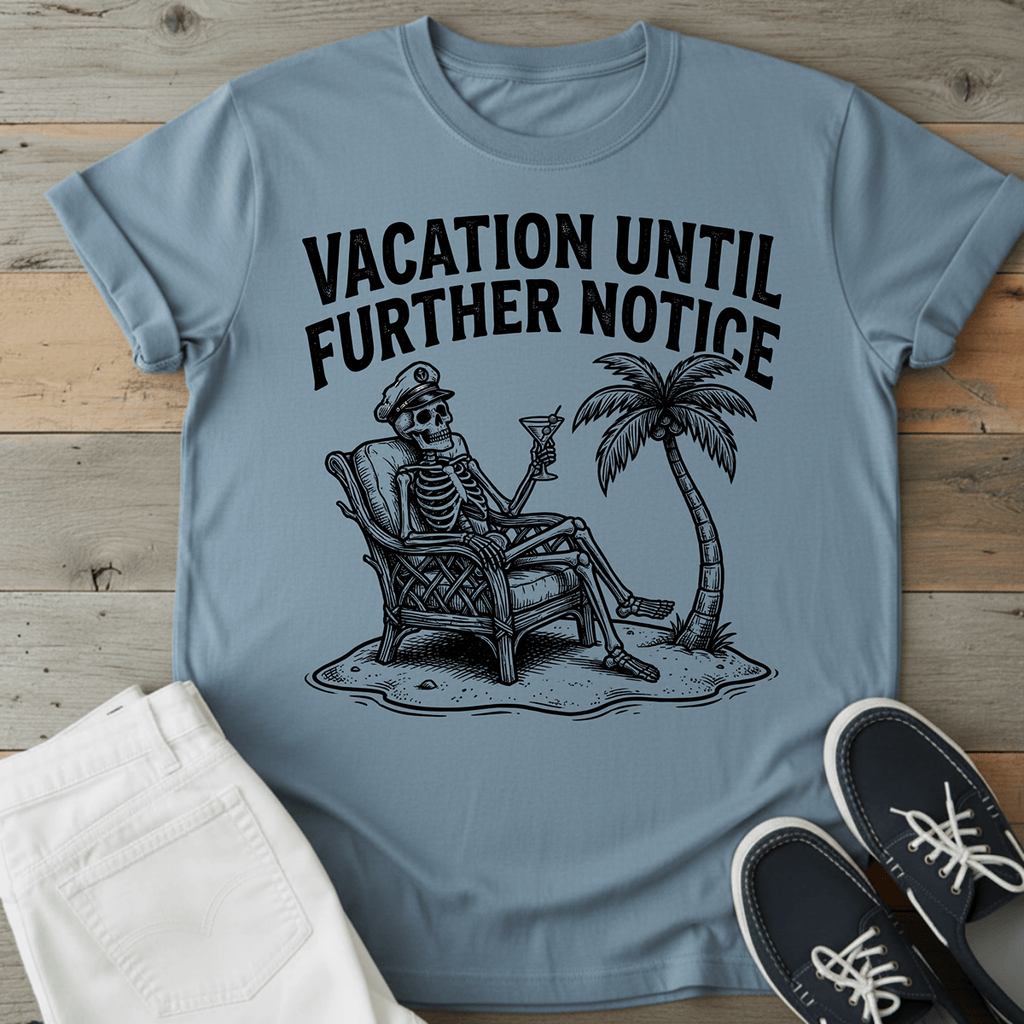 Retro Beach Skeleton T-Shirt featuring a skeleton relaxing with a drink under a palm tree, in light blue.