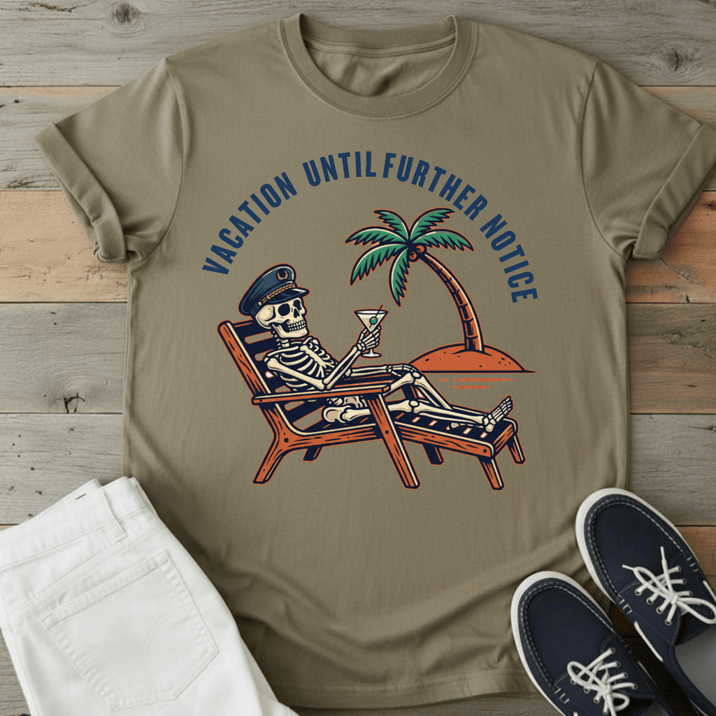 Optimistic Castaway T-Shirt featuring a skeleton in a beach chair with palm tree and drink, in a tan color.